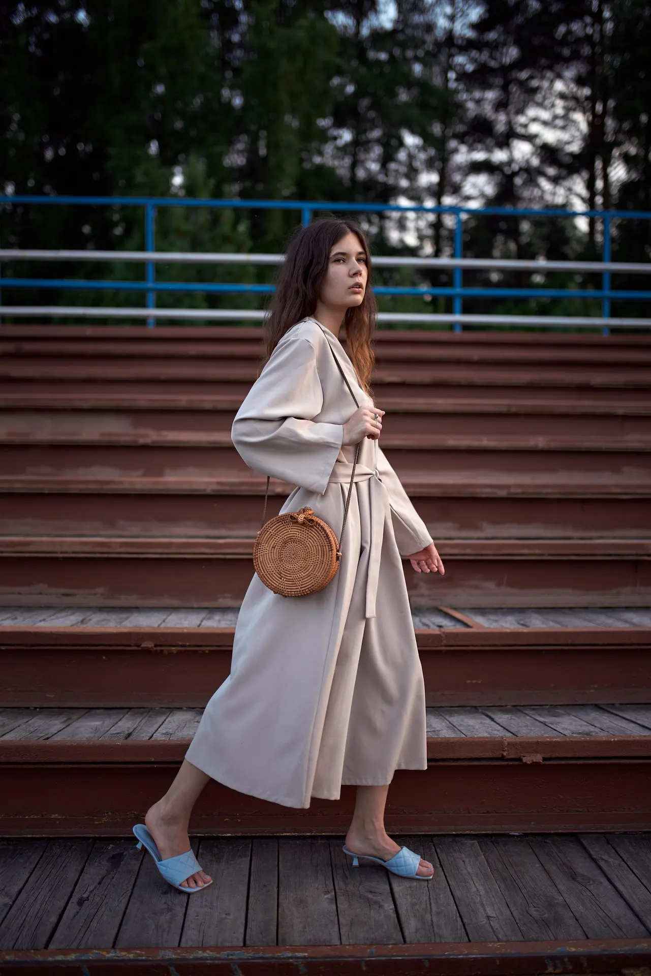 Nana in a long coat on outdoor steps