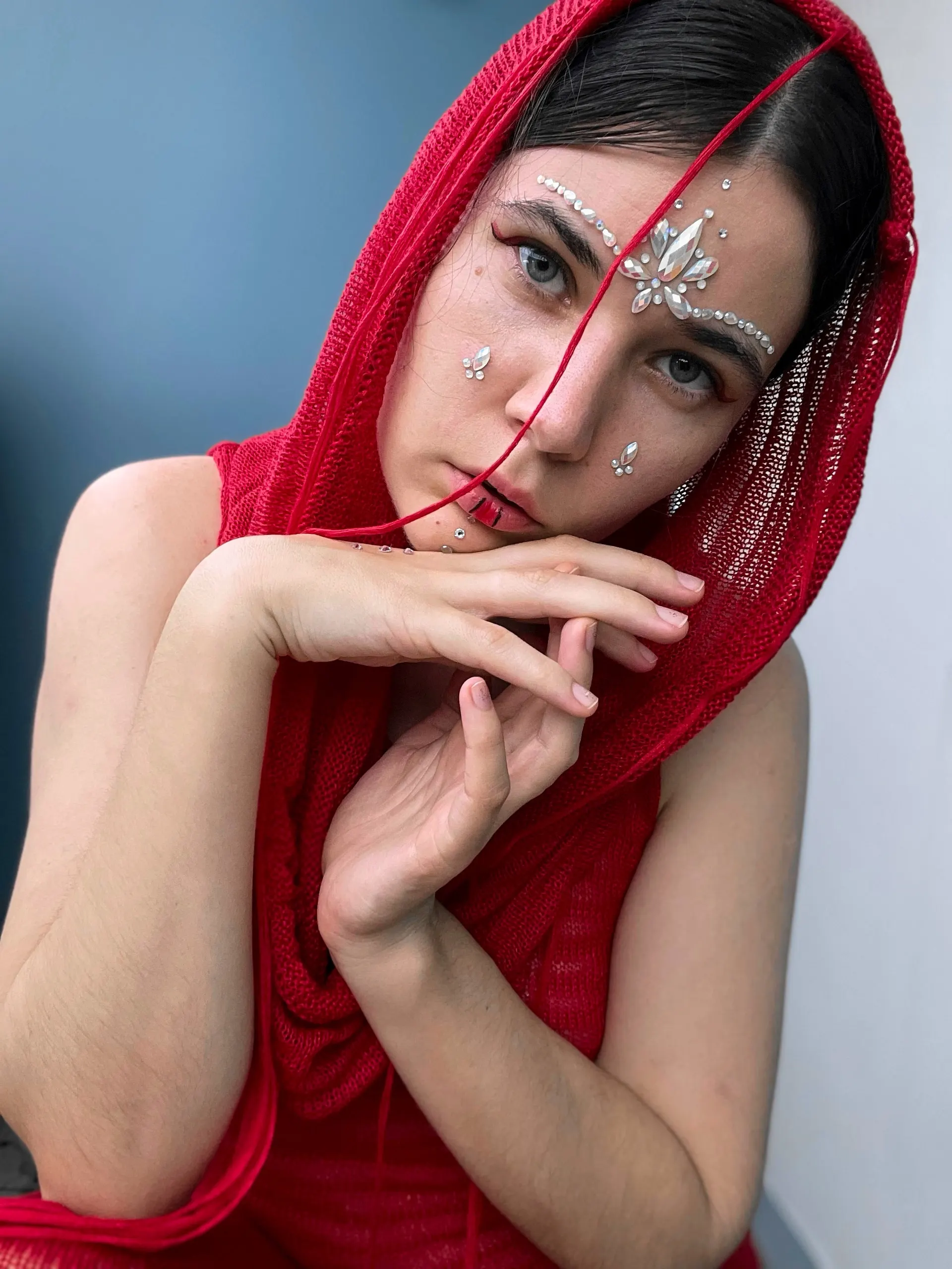 Nana in a red headscarf with silver jewelry