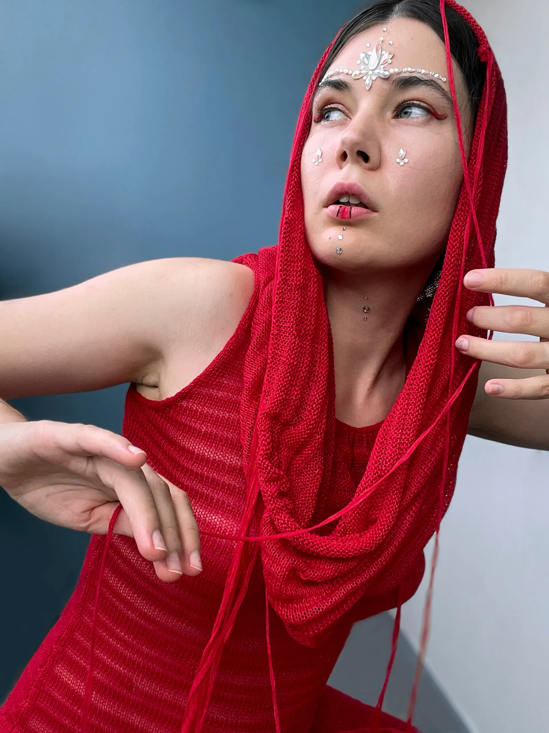 Nana looking upward in a red headscarf