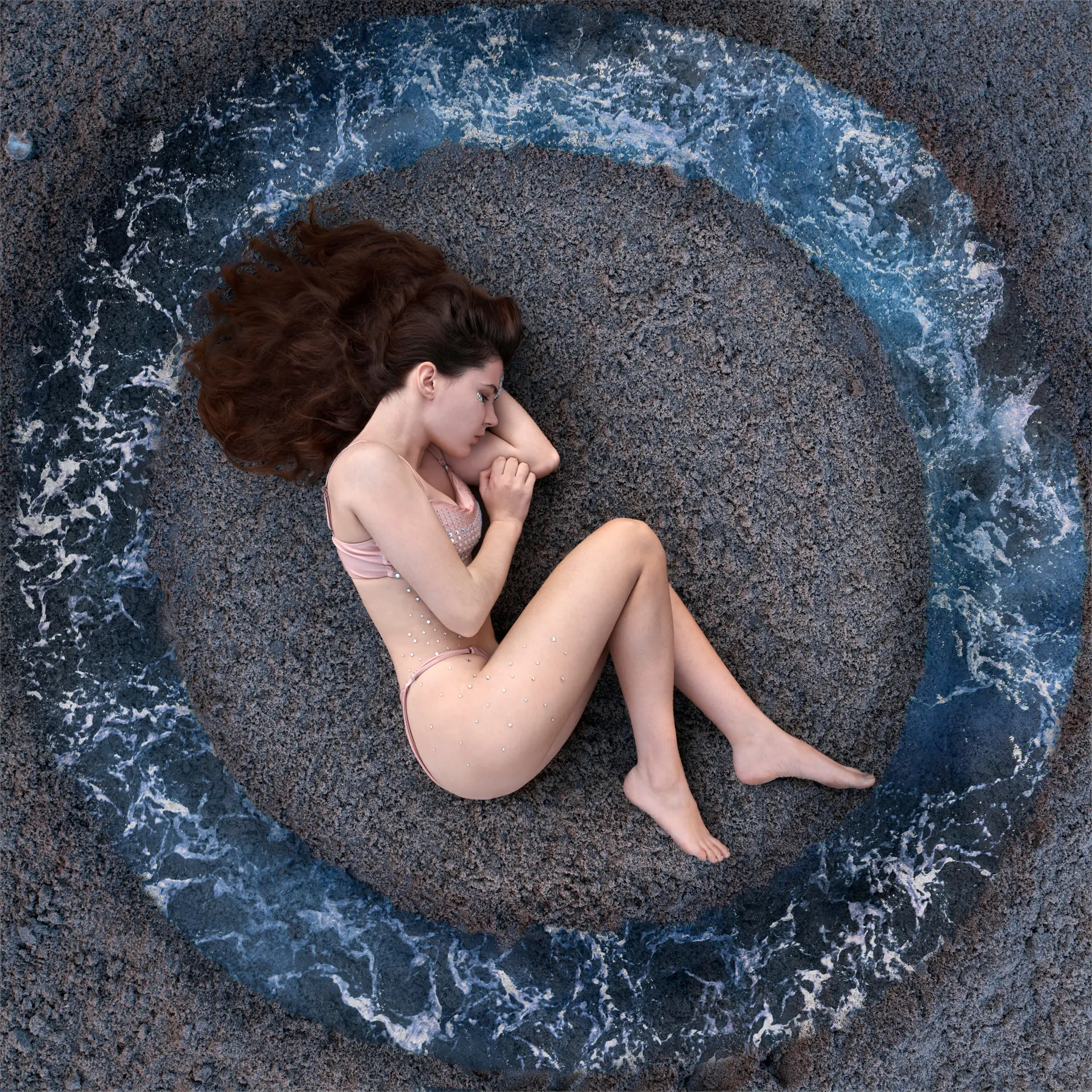 Overhead portrait of Nana curled up in shallow water