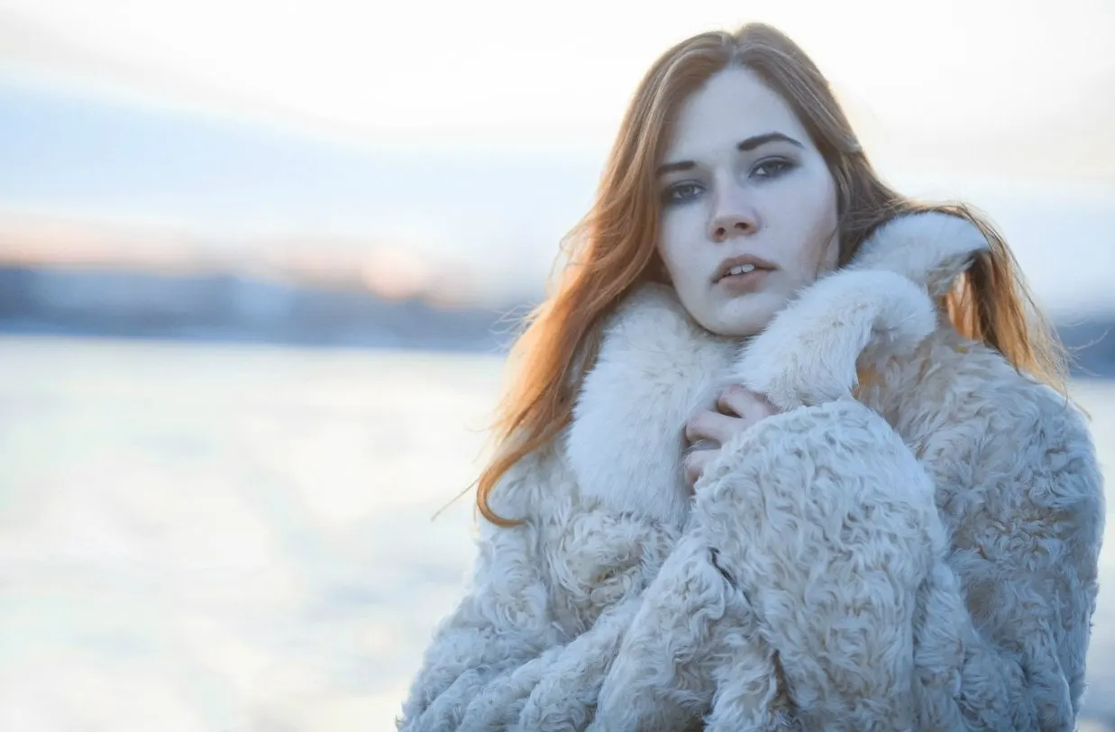 Nana wrapped in a textured coat outdoors
